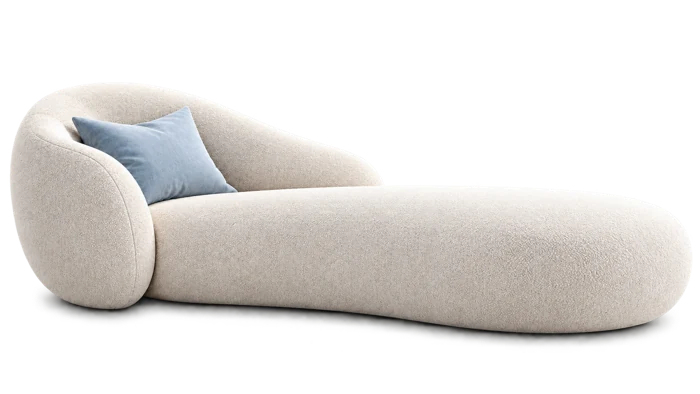 A welcoming cream therapy chaise with a pale blue cushion